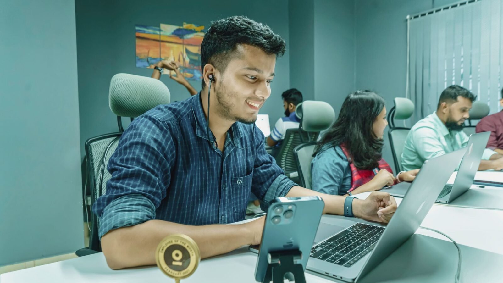 Tech developers collaborating in Bangalore amidst rising Indian AI funding.
