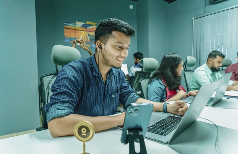 Tech developers collaborating in Bangalore amidst rising Indian AI funding.