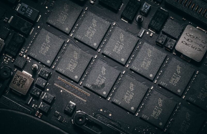A modern data center and computer chip representing AI infrastructure.